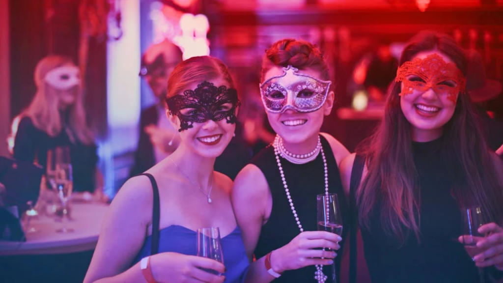 Adult Halloween Party l Free Photo of Women Wearing Masks Stock Photo